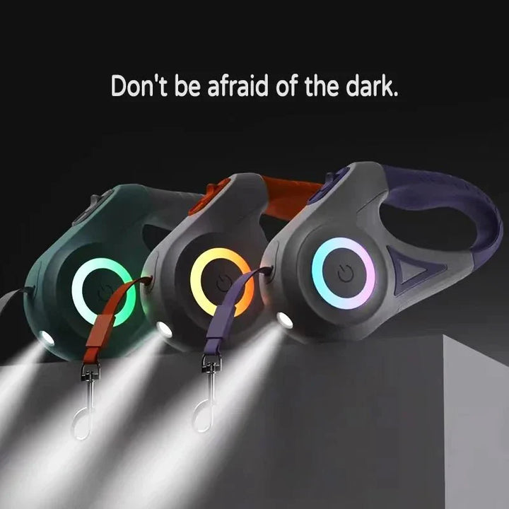 Three colorful keychain lights with glowing beams on a dark background, accompanied by the text 'Don't be afraid of the dark.'.