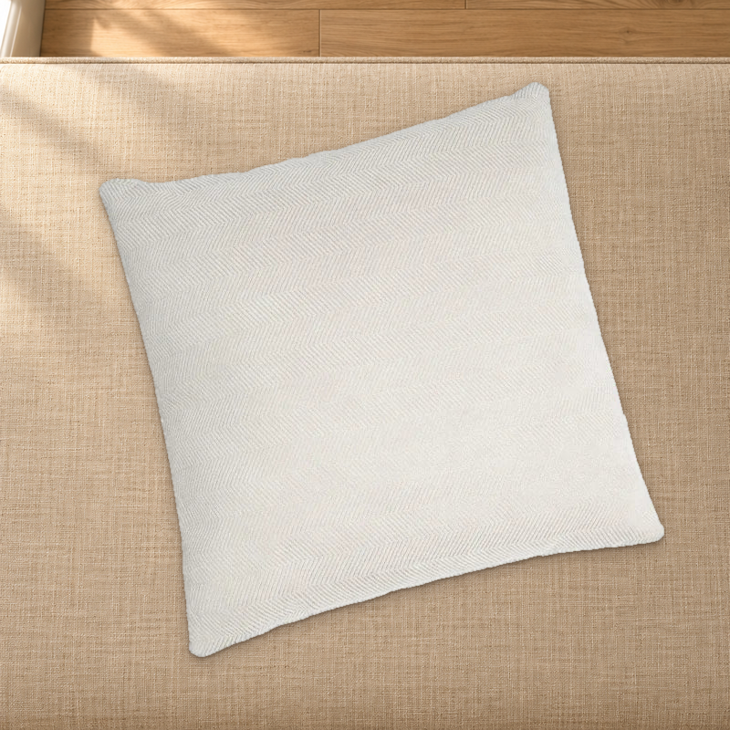 Beige herringbone chenille pillow styling reference resting on a fabric-covered bench