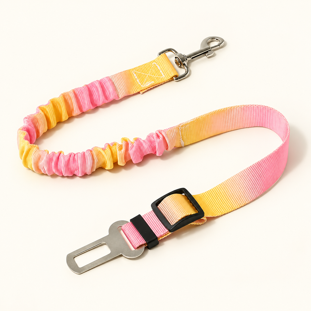Pink and yellow tie-dye car tether with silver snap and tongue and black length adjuster