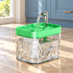 Green AquaArc fountain in a naturally lit home setting, with its original tank, top tray and outlet configuration.