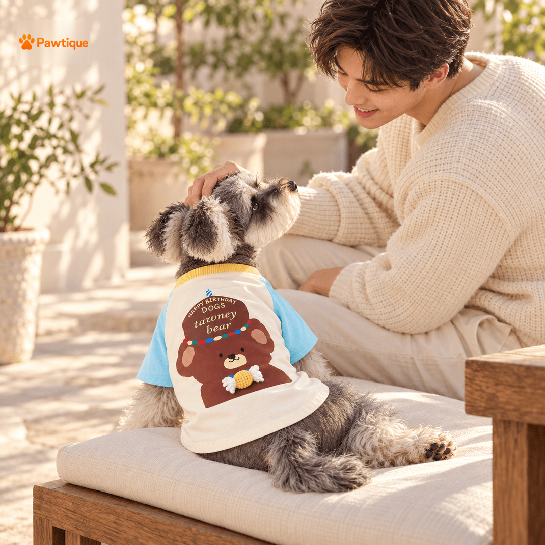Dog and owner sharing a quiet outdoor moment in the Birthday Bear T-shirt