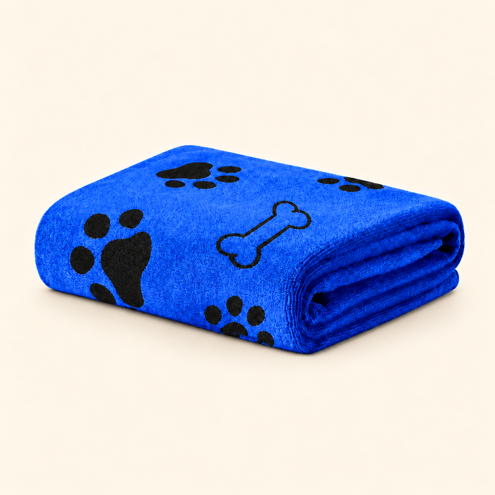 Blue Pawtique Bone and Paw microfiber pet towel folded on a warm cream background