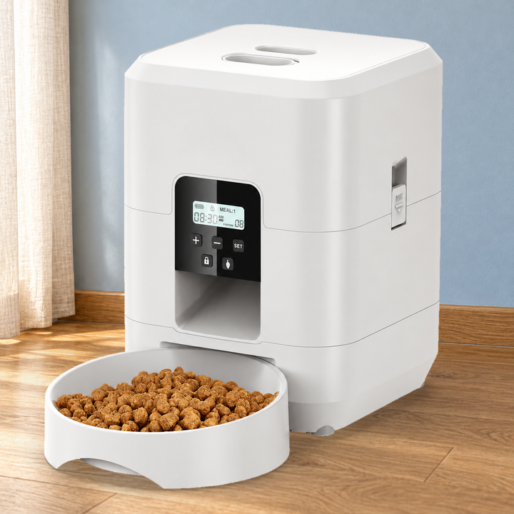 White button-control feeder with original LCD, five buttons and matching food bowl in a naturally lit home setting.