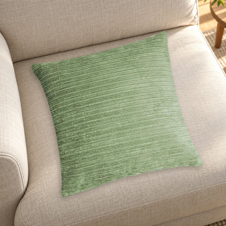 Green striped chenille pillow color reference on a neutral sofa; insert inclusion is not specified