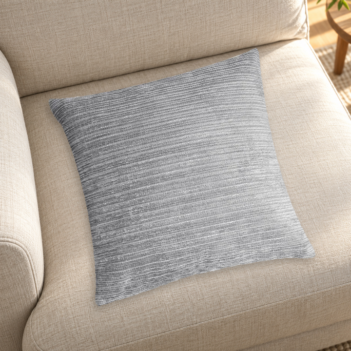 Grey striped chenille pillow color reference on a neutral sofa; insert inclusion is not specified