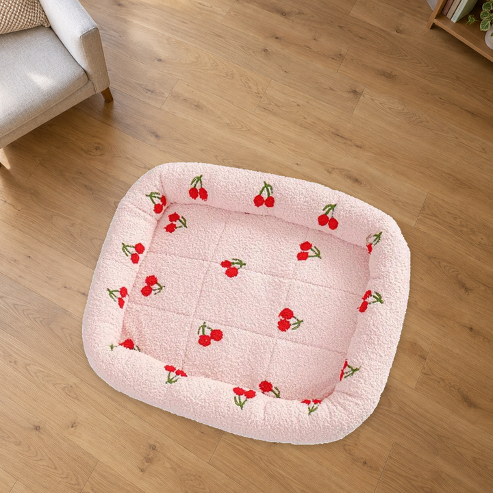 Pink Cherry Print pet bed with red cherries and a quilted center