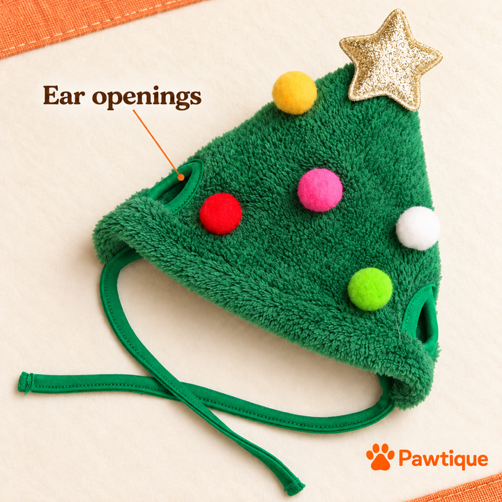 Green Christmas tree hat showing bound ear openings, fabric ties, five colorful pom-poms and gold-tone star