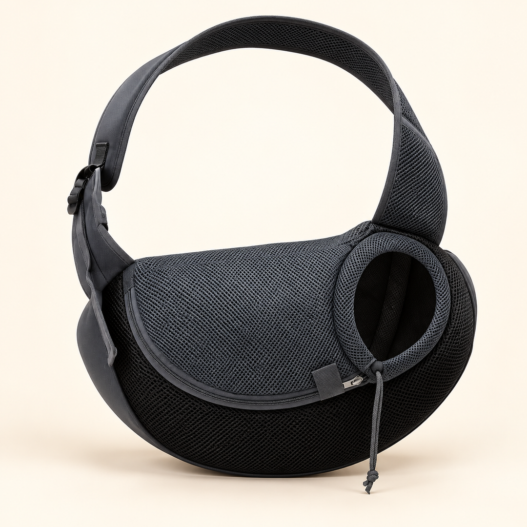 Pawtique CloseNest gray and black mesh pet sling with broad strap, zippered entry and drawcord head opening on a cream background