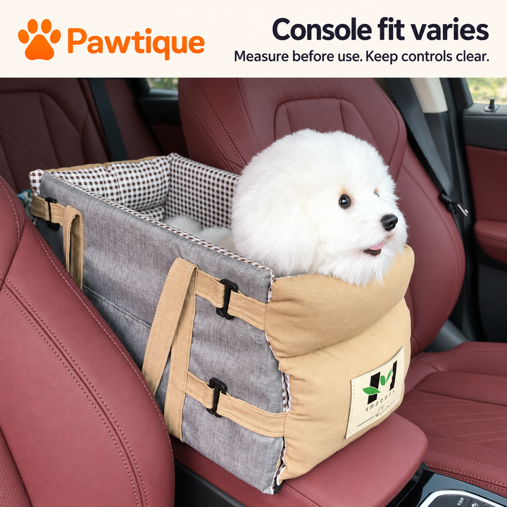 Grey console pet bag shown between vehicle seats with a reminder to measure fit and keep controls clear