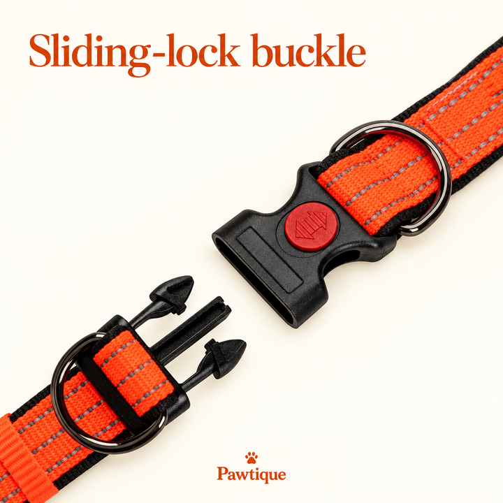 Open orange side-release buckle with circular red sliding lock