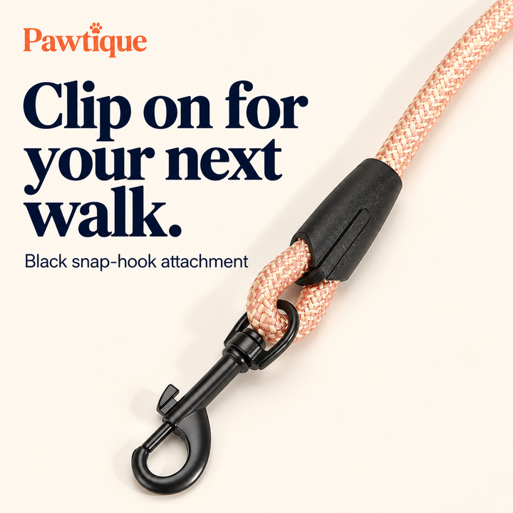Close-up of black swivel snap hook and pink rope connection sleeve