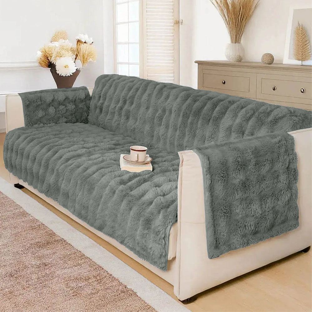 Grey sofa plush furniture cover in a naturally lit living room; furniture and props not included.