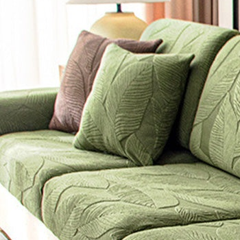 EverLeaf green leaf-patterned pillow shown on a sofa; styling props are not the selected option contents.