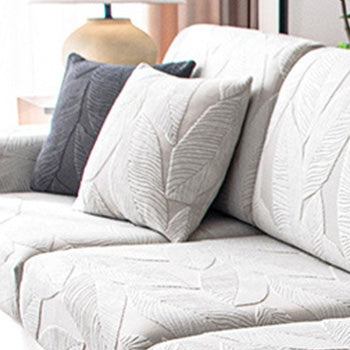 EverLeaf light grey leaf-patterned pillow shown on a sofa; styling props are not the selected option contents.
