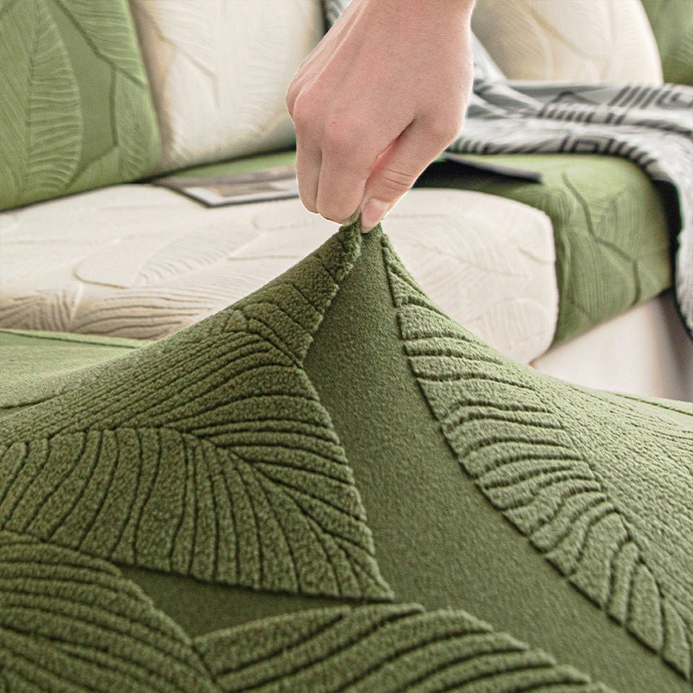 Hand stretching the original EverLeaf green leaf-patterned cover fabric.