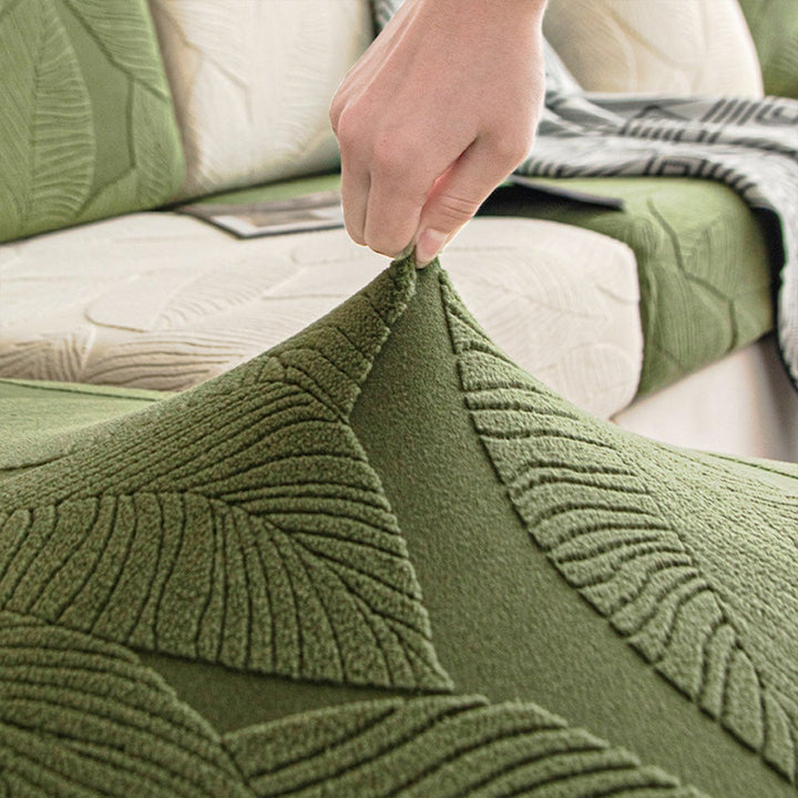 Hand stretching the original EverLeaf green leaf-patterned cover fabric.