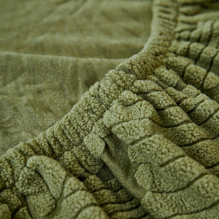 Close view of original green leaf-patterned fabric and elastic edge.