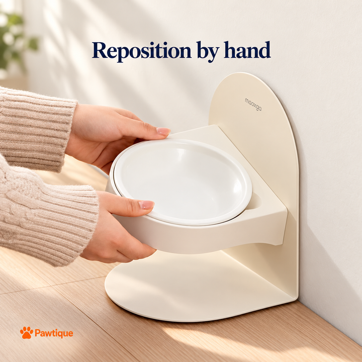 Hands repositioning the ceramic bowl holder on the arched stand