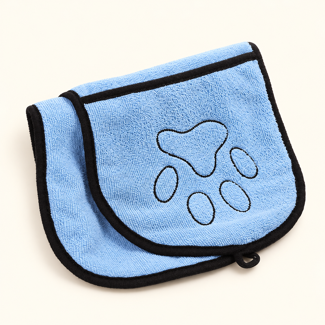 Light blue microfiber pet drying towel folded to show its rounded hand pocket