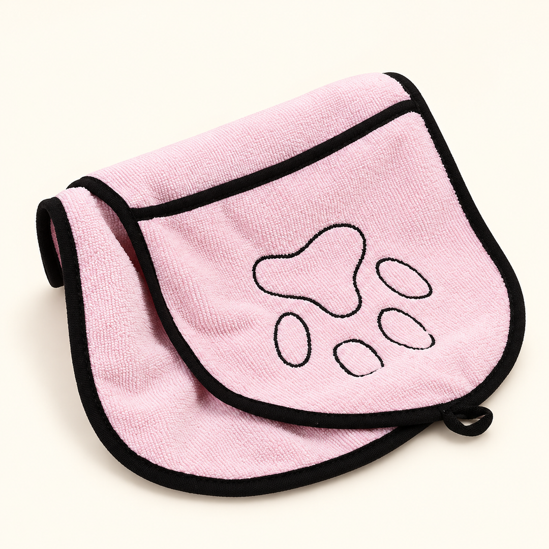 Pink microfiber pet drying towel with black bound edges, paw embroidery and hanging loop
