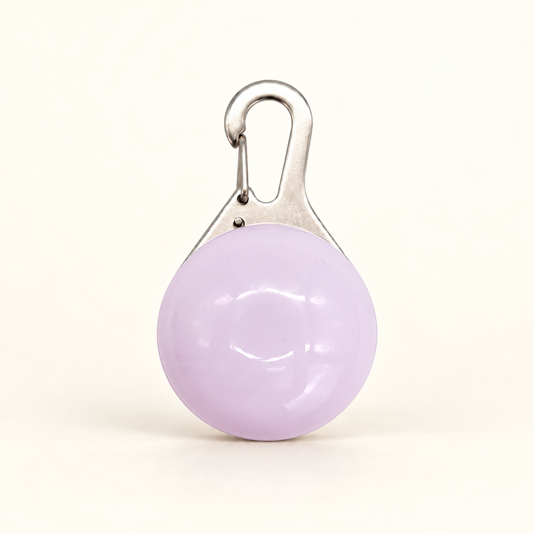 White clip-on LED collar pendant with faint lilac-tinted shell and silver hook