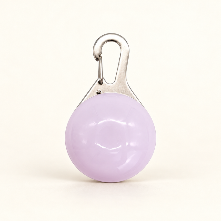 White clip-on LED collar pendant with faint lilac-tinted shell and silver hook