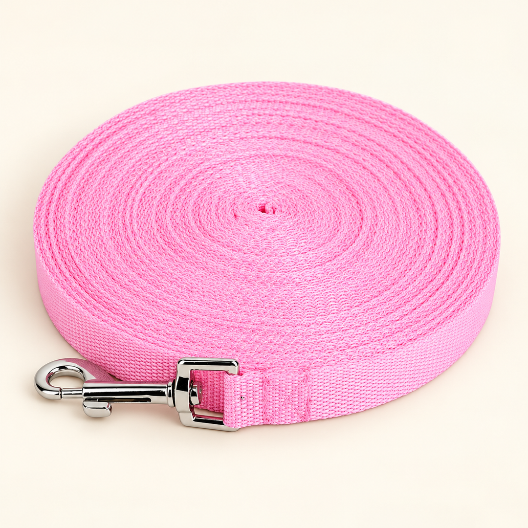 Pawtique pink long-line dog training leash with silver snap clip on cream
