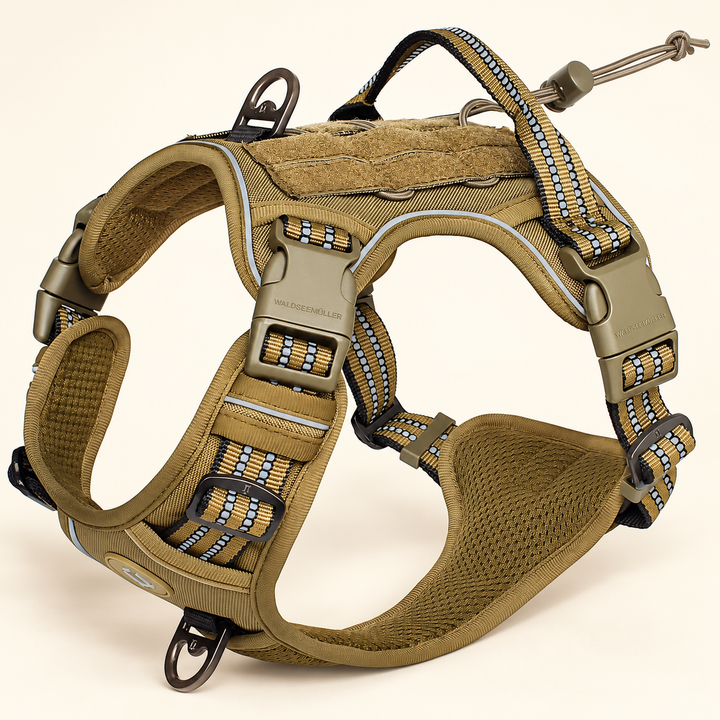 Khaki adjustable MOLLE dog harness showing its buckles, straps, handle and mesh lining