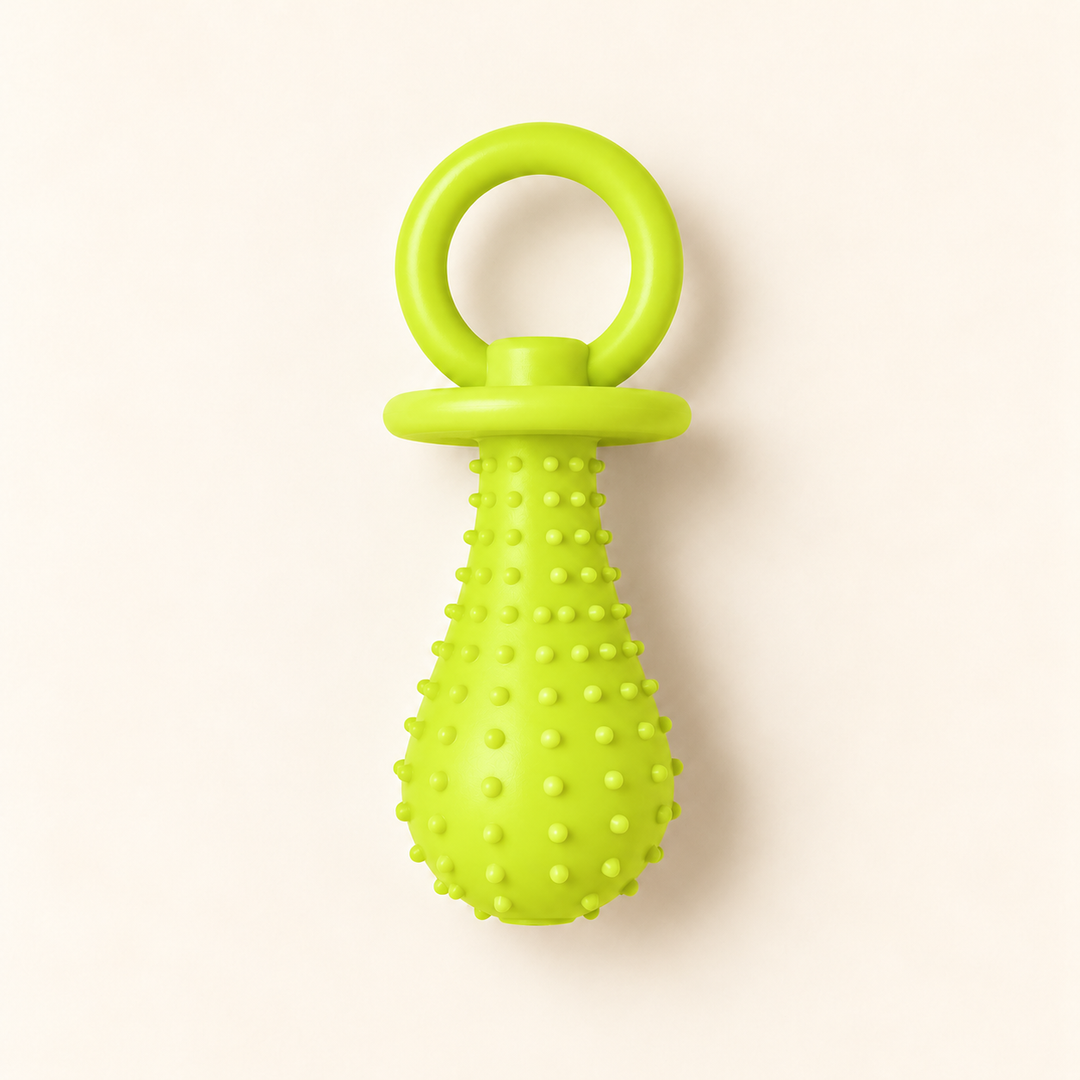 Pawtique PaciPlay TPR pacifier dog toy in Lime Green, Large, on a warm cream background.