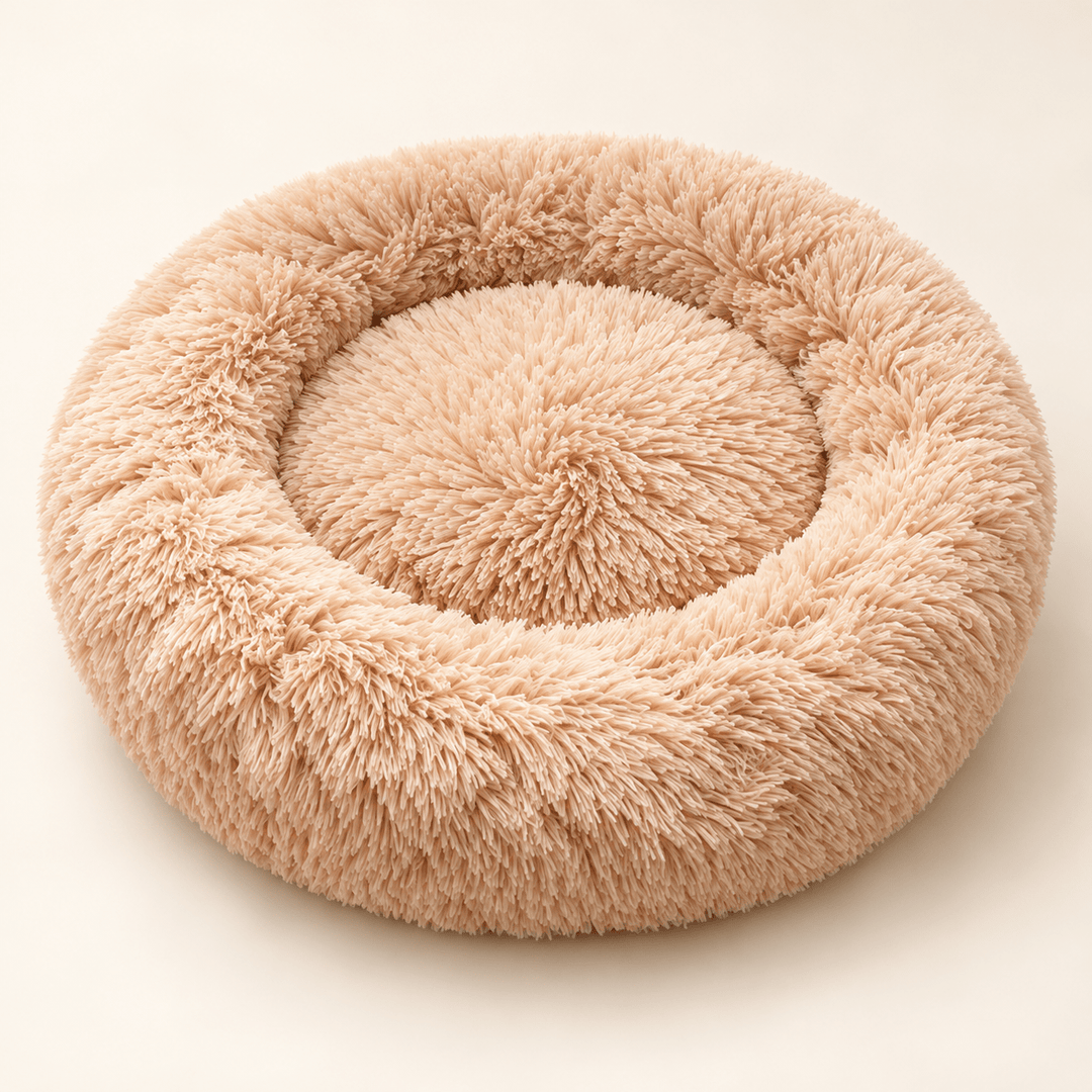 Beige Plush Donut Cuddler bed with a raised plush rim and recessed round center.