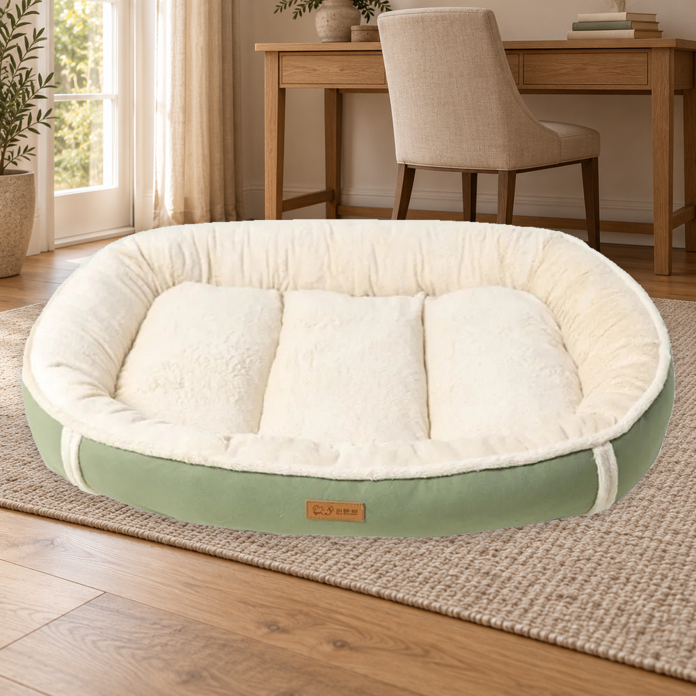 Green bolster dog bed with cream plush-textured rim and segmented center