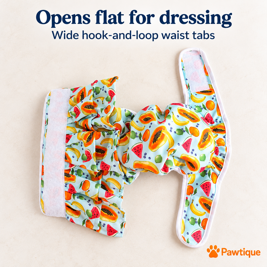 Fruit-print diaper pants opened flat, showing hook-and-loop waist fastening