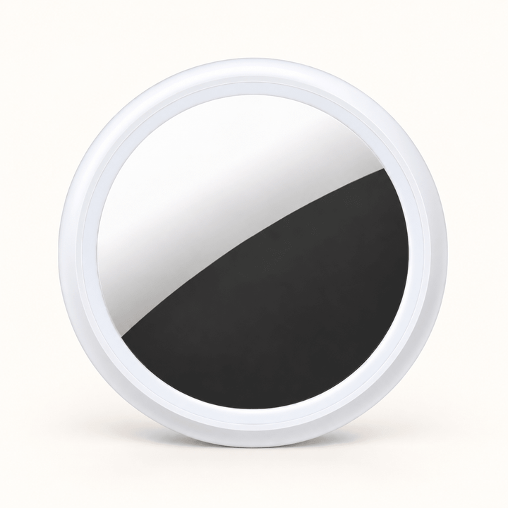 One white circular S10 Bluetooth item finder on a warm cream background