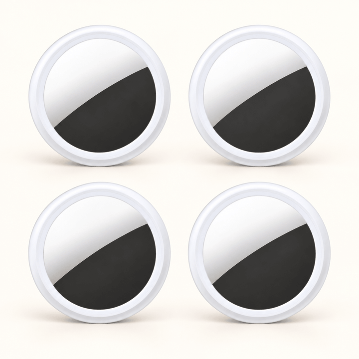 Four white circular S10 Bluetooth item finders on a warm cream background