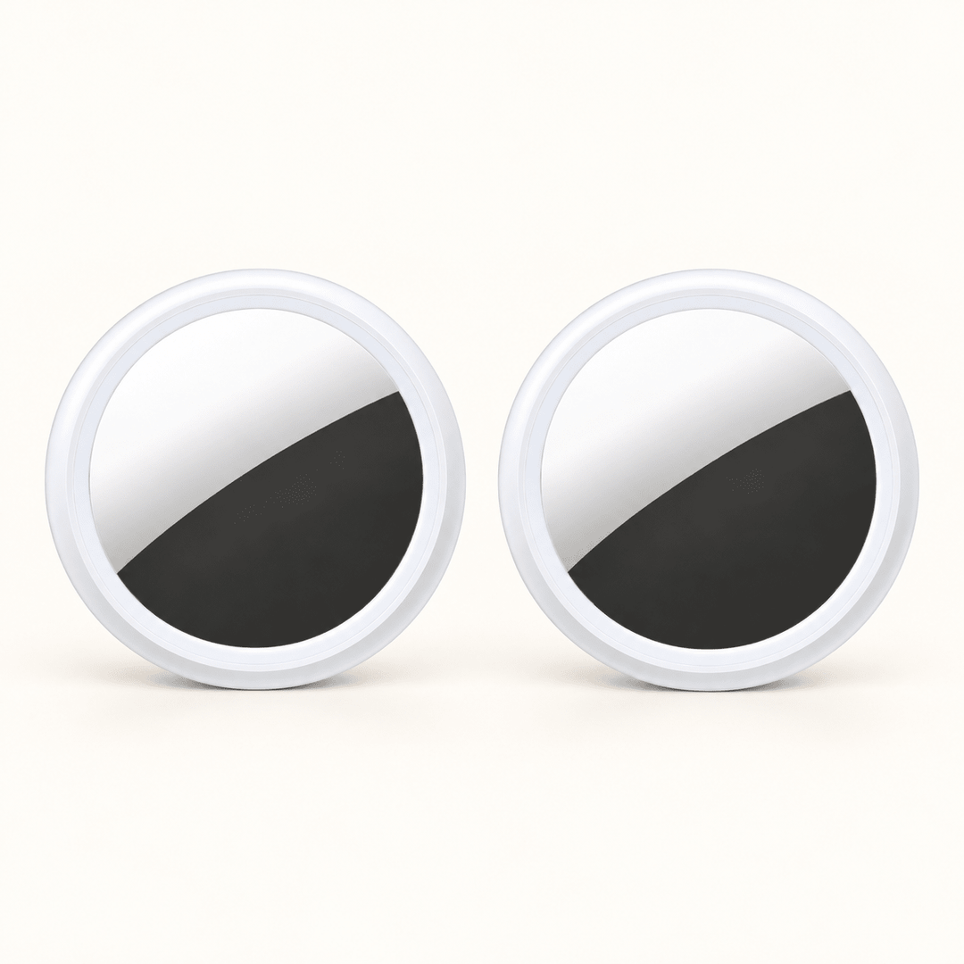 Two white circular S10 Bluetooth item finders on a warm cream background