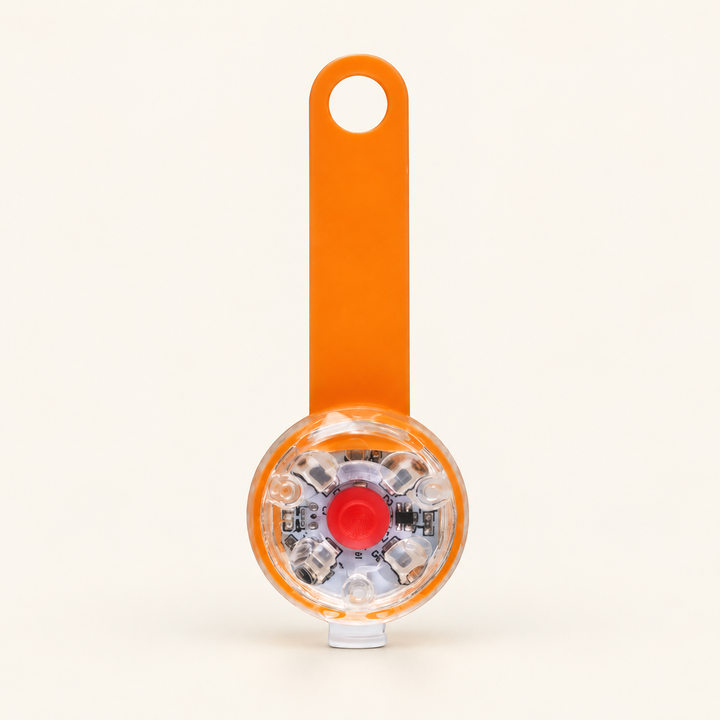 Orange rechargeable LED collar light, flexible strap with clear round lamp and red center button