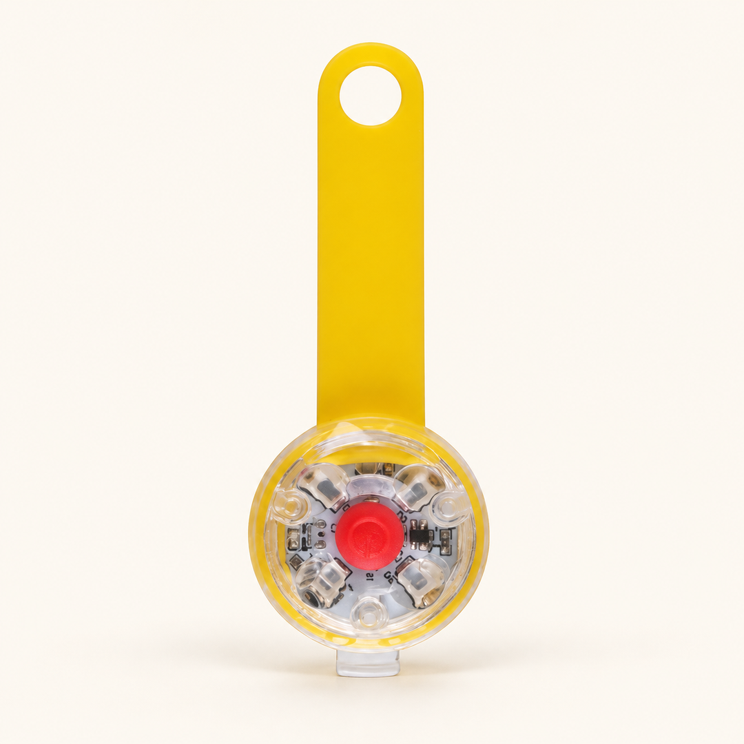 Yellow rechargeable LED collar light, flexible strap with clear round lamp and red center button