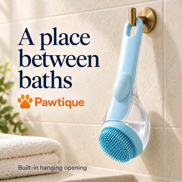 Blue bath brush hanging by its built-in handle opening beside a bathroom towel