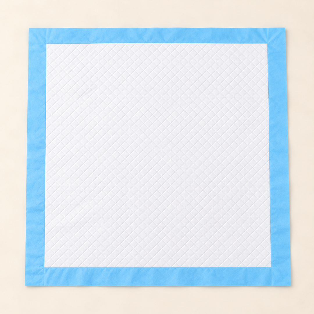 Square disposable training pad with white quilted surface and flat blue border